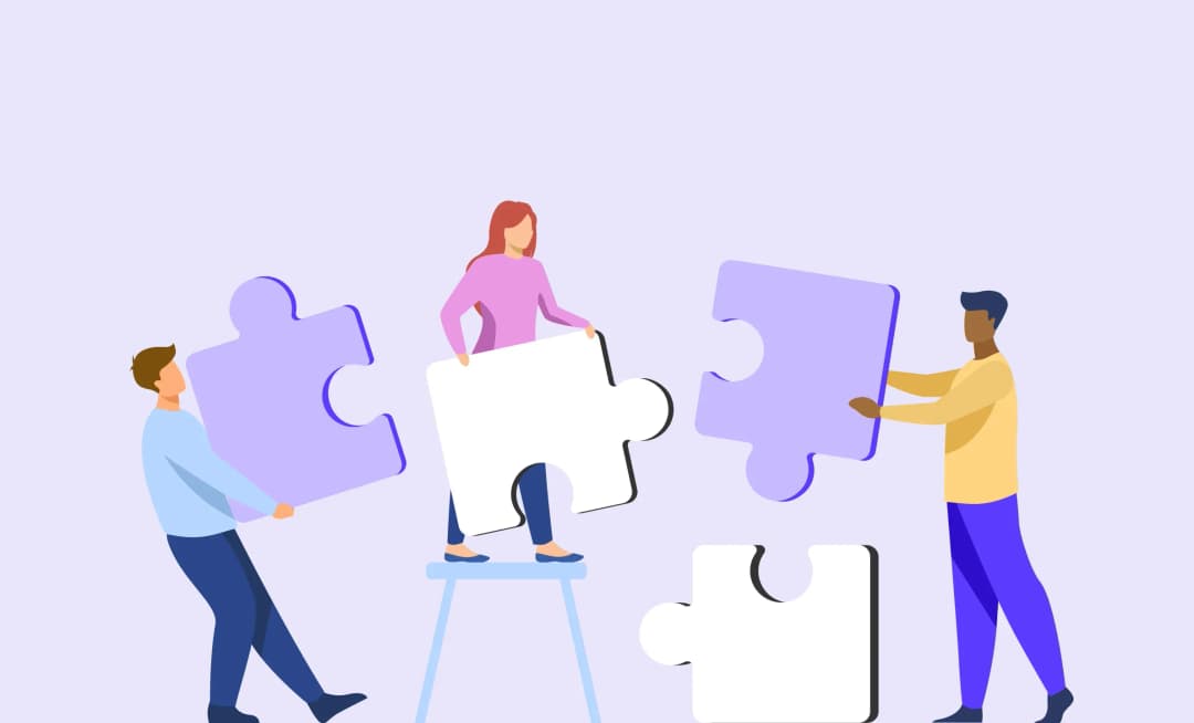 people holding puzzle pieces in development team