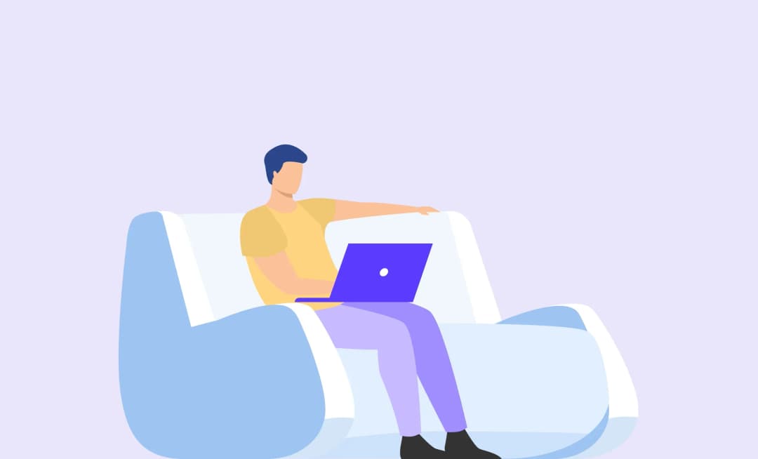 a mav sitting on the sofa working as freelancer in development team